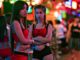 Two Thai women working at a bar in the red light district in Bangkok