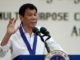 Philippine President Rodrigo Duterte gestures while delivering a speech during the 115th