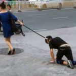 Woman takes her male companion for a walk on a DOG LEASH in China