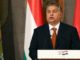 Hungarys PM threatens to sue EU over mandatory migrant quotas
