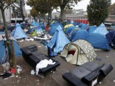 Police clear Paris migrant camp that swelled after Calais closure