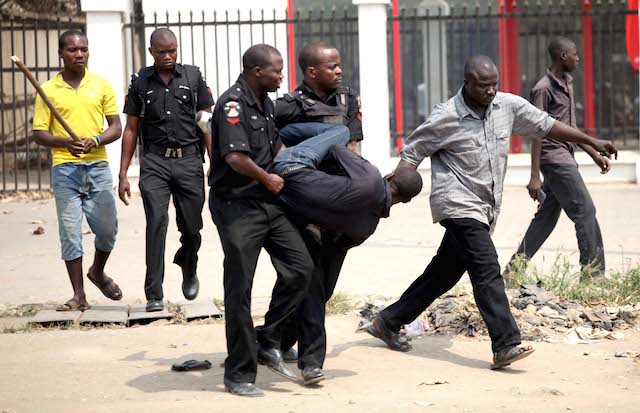 Nigerian policemen make an arrest