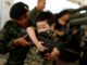 Thai army invites in kids for gun play