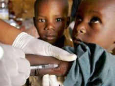 child takes meningitis vaccine. BBC Photo