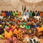 Buhari in the middle sitting back row with Chibok Girls