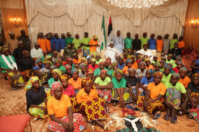 Buhari in the middle sitting back row with Chibok Girls