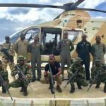 NAF helicopter with some officers