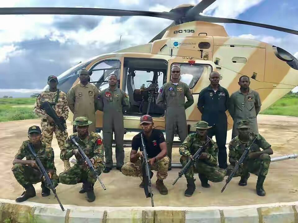 NAF helicopter with some officers