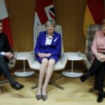 Britains Prime Minister Theresa May is French President Emmanuel Macron and German Chancellor Angela Merkel 696x522