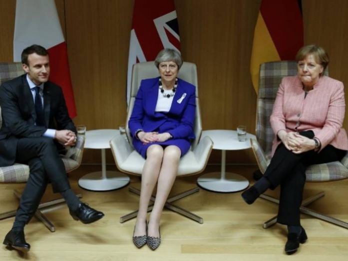 Britains Prime Minister Theresa May is French President Emmanuel Macron and German Chancellor Angela Merkel