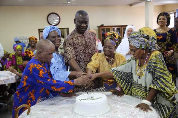 Senator Ike Ekweremadu cutting his 56th birthday cake during his visit at the old peoples home in Enugu
