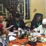 Senator Ovie Omo Agege middle and his team summing up the result e1532126204416