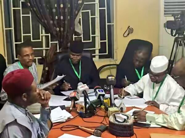 Senator Ovie Omo Agege middle and his team summing up the result e1532126204416