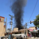 Smoke rises from an area where explosions and gunshots were heard in Jalalabad city