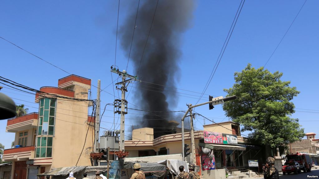 Smoke rises from an area where explosions and gunshots were heard in Jalalabad city