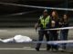 A dead victim of the knife attack in Melbourne Australia and a person being asked to leave the area by police e1541751019698