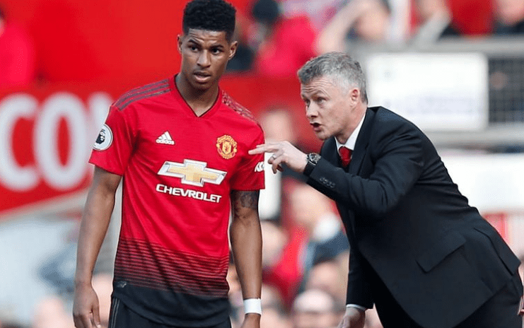 Manchester United manager Ole Gunnar Solskjaer speaks with Manchester Uniteds Marcus Rashford during the match REUTERSAndrew Yates