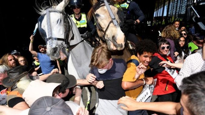 Climate protesters clash with police in Melbourne, scores injured