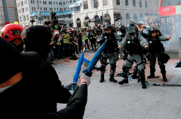 Hong Kong enters recession as media decry treatment of journalists