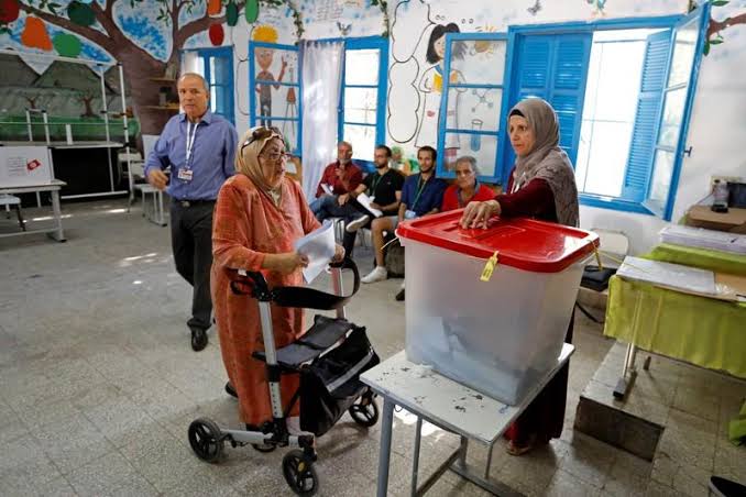 Tunisians vote for new parliament at tough economic moment