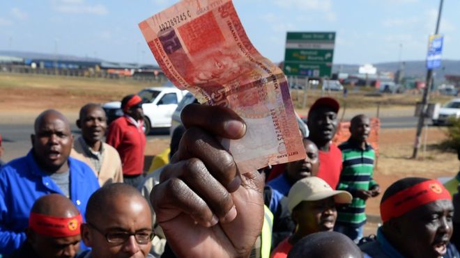 South African Economy - A South African holding South African Rand