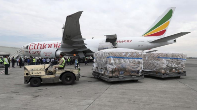 An Ethiopian Airlines worker transports a consignment of medical donation from Chinese billionaire Jack Ma and Alibaba Foundation to Africa for coronavirus disease