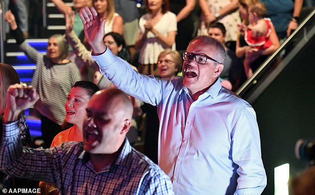 Prime Minister Scott Morrison (pictured) is seen singing during an Easter Sunday service at his church, Horizon, in Sydney's Sutherland Shire in 2019