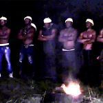 Cultists carrying out initiation