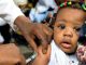 child being immunised