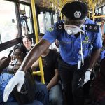 Nigerian Security Agents Doing Covid 19 Guideline Inspection in a crowded bus