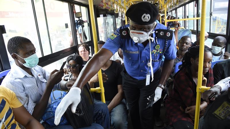 Nigerian Security Agents Doing Covid-19 Guideline Inspection in a crowded bus