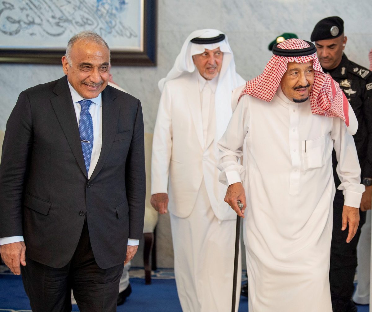 Iraqi PM Adel Abdul Mahdi walks with Saudi Arabia's King Salman bin Abdulaziz during meeting in Jeddah