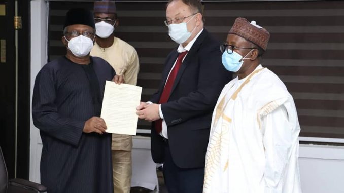 L-R The HMH Dr. Osagie Ehanire, His Excellency Alexey Shebarshin and permanent Secretary A. M Abdullah while presenting his document.
