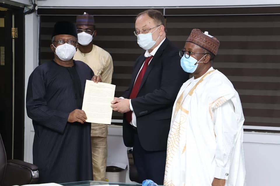 L-R The HMH Dr. Osagie Ehanire, His Excellency Alexey Shebarshin and permanent Secretary A. M Abdullah while presenting his document.