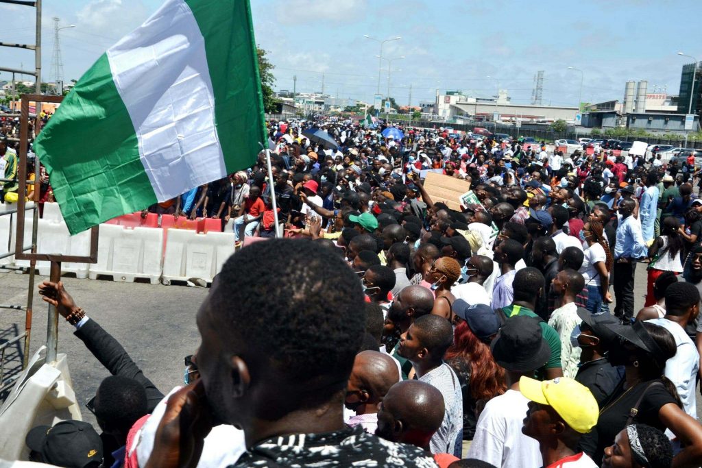 EndSars Protesters At Lekki Toll Gage Hold Nigerian Flags Before Being Shot At By Nigerian Military