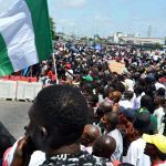 EndSars Protesters At Lekki Toll Gage Hold Nigerian Flags Before Being Shot At By Nigerian Military