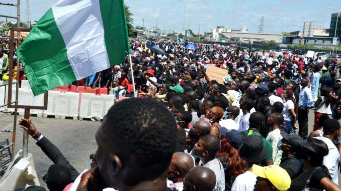 EndSars Protesters At Lekki Toll Gage Hold Nigerian Flags Before Being Shot At By Nigerian Military