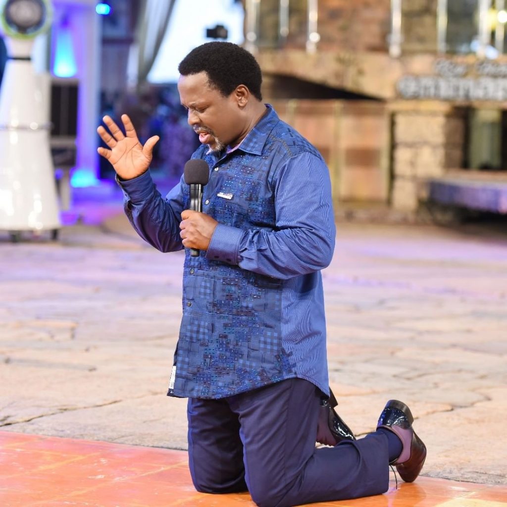 Prophet TB Joshua kneeling down