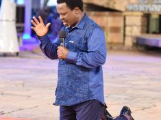 Prophet TB Joshua kneeling down