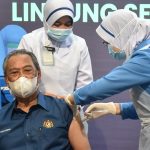 Malaysian PM Muhyiddin receives COVID-19 jab as vaccine roll-out begins in the country