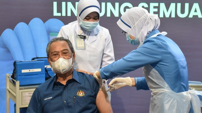 Malaysian PM Muhyiddin receives COVID-19 jab as vaccine roll-out begins in the country