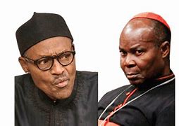 This image has an empty alt attribute; its file name is Olubunmi-Okogie-and-Buhari.jpg