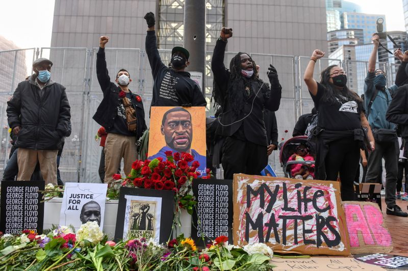Protesters march through downtown Minneapolis during the "I Can't Breathe" Silent March for Justice the day before Derek Chauvin's trial