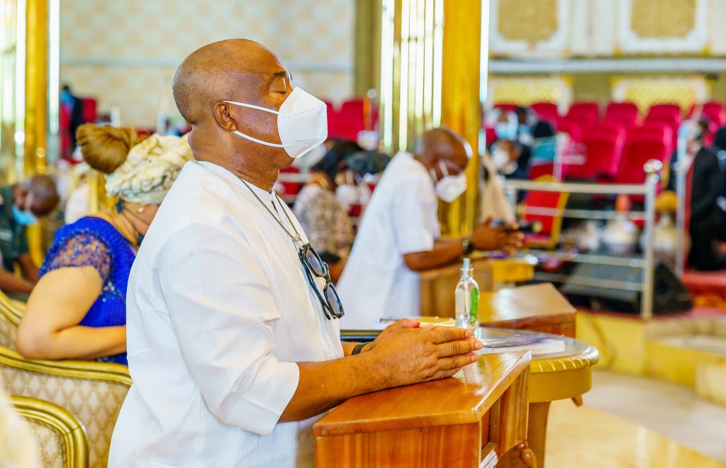 Imo State Governor, Hope Uzodinma praying in a church