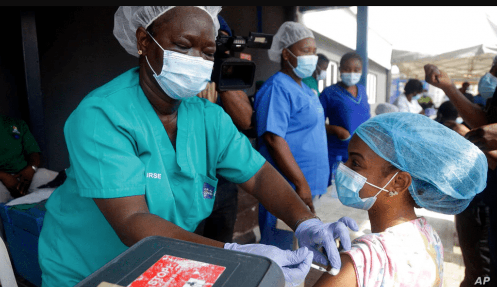 Hospital staff receives one of Nigeria's first coronavirus vaccinations using AstraZeneca COVID-19 vaccine manufactured by the Serum Institute of India and provided through the global COVAX initiative, at Yaba Mainland hospital in Lagos, March 12, 2021.