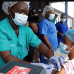 Hospital staff receives one of Nigerias first coronavirus vaccinations using AstraZeneca COVID 19 vaccine manufactured by the Serum Institute of India and provided through the global COVAX initiative at Yaba Mainland hospital in Lagos March 12 2021