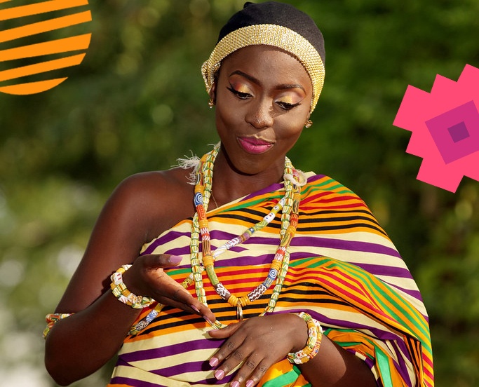 A Ghanaian girl dressed in traditional wears adorned with beads