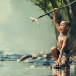 Do Not Despise the Day of Small Things   Image Small boy catches a small fish by spearfishing