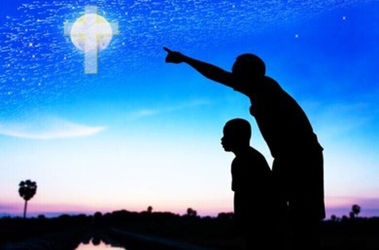 Father pointing out a cross to his son