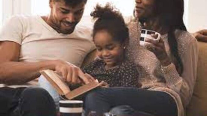 Father reading Bible to child